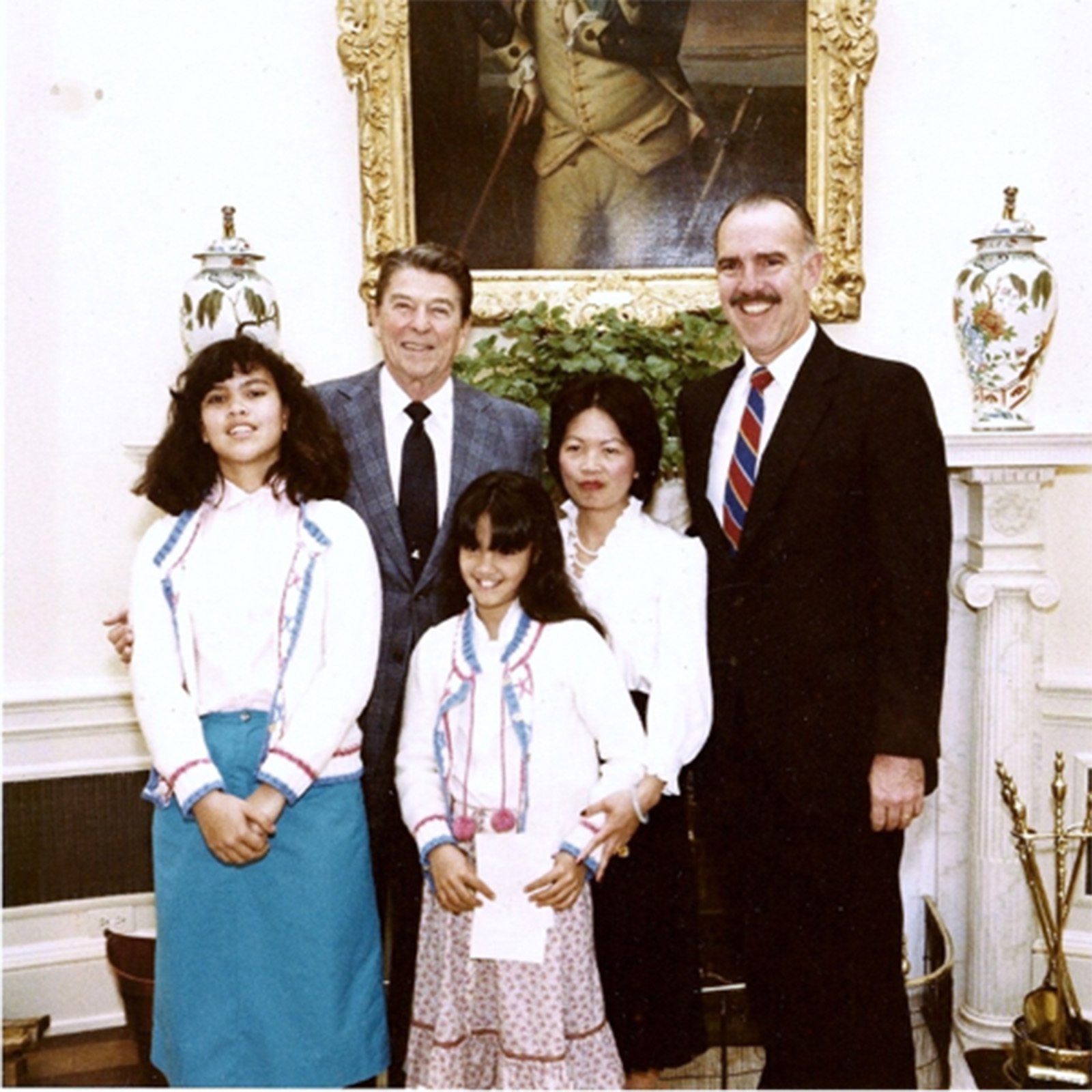 James Bullington with his wife Tuy-Cam and daughters Kim and Eva, in the Oval Office with President Reagan when he was appointed Ambassador to Burundi in 1986. (Photo courtesy of James Bullington)