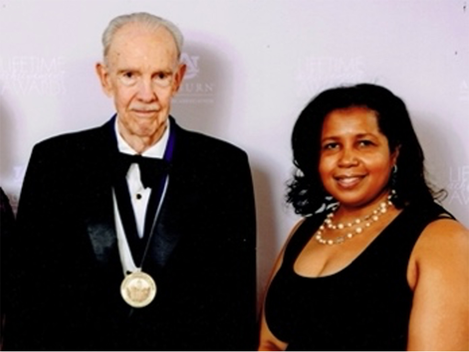 The Lifetime Achievement Award medal was formally presented by Regenia Sanders, president of the Auburn Alumni Association. (Photo courtesy of James Bullington)